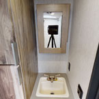 Bathroom vanity, mirror, and storage